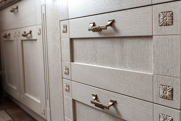Retro handles metal cabinet in the kitchen