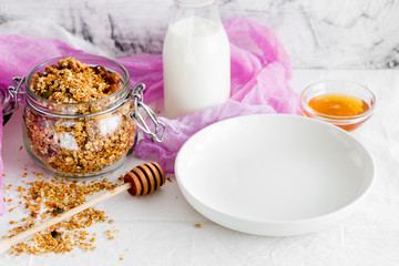 Homemade granola, muesli with yogurt in glasses