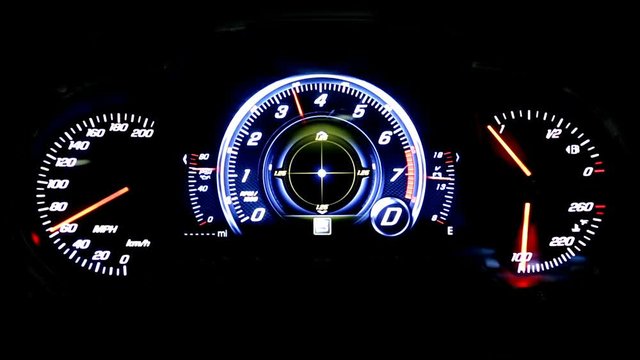 Modern light car mileage (dashboard, milage) isolated on a black background. New display of a modern car. MPH, fuel and temperature (Fahrenheit) digital indicators.
