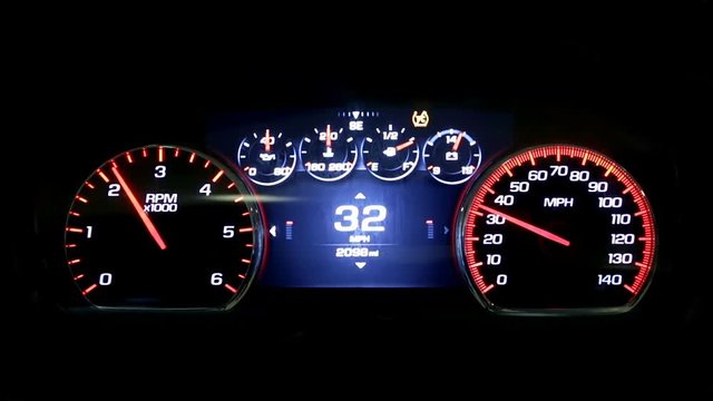 Modern light car mileage (dashboard, milage) isolated on a black background. New display of a modern car. RPM and MPH.