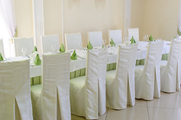 table set service with silverware and glass stemware at restaurant before party