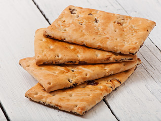 Tasty baked cookies on old wooden background.