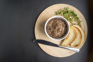 liver pate with toast on a round Board