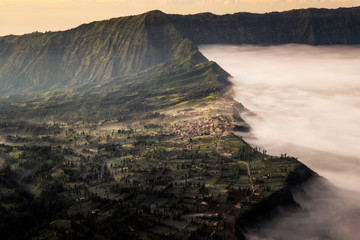 The morning light on fog and mist at Cemoro Lawang village in Br