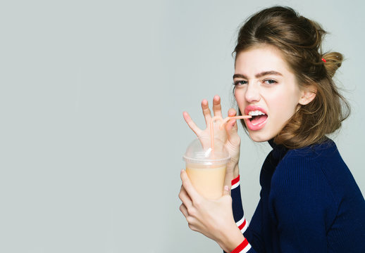 girl drinking juice from glass