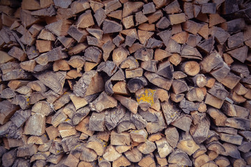 Background of firewood stacked in the cut wood.