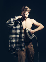 Sexy topless man with iron