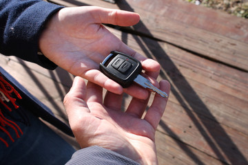 Buyer's hand taking a car key.