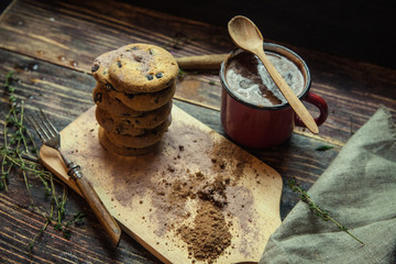 Chocolate chip cookies on plate on grey wooden background