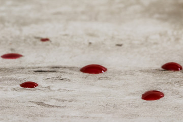 red blood droplets on table