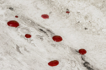 red blood droplets on table