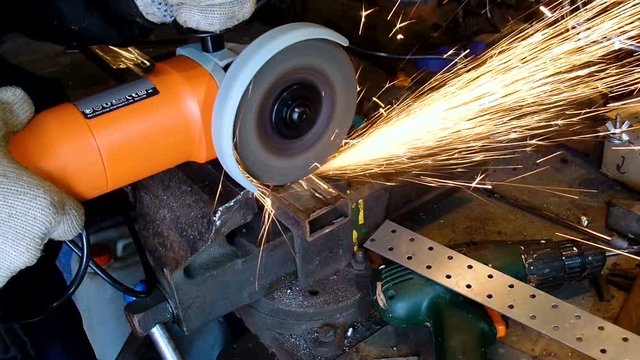 Sparks during cutting of metal angle grinder