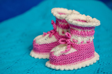 Small white-pink children's knitted booties 