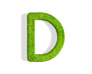 Grass letter D in uppercase format from top angle with shadow on ground.