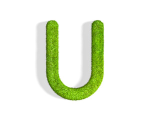 Grass letter U in uppercase format from top angle with shadow on ground.