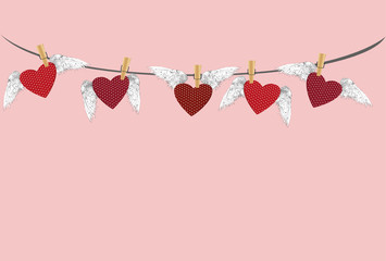 Five Red hearts with wings hanging on a rope. clothes pegs