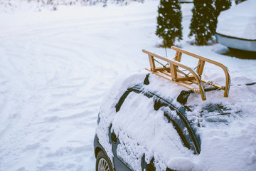 Car with sled on the roof rack