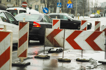 Naklejka premium road works on the street with car in background, winter,