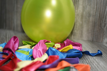 Colored balloons on a wooden table.