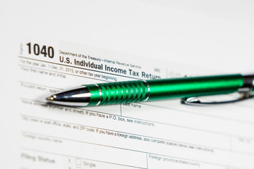 Tax time. Tax form with pen