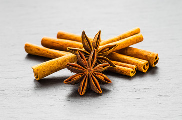Mulled wine ingredients spices. Anise, cinnamon, cardamom on sto