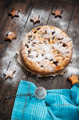 Cherry pie and cookie on rustic wooden background