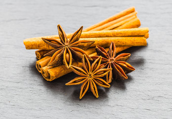 Mulled wine ingredients spices. Anise, cinnamon, cardamom on sto