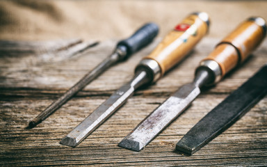 Old hand tools on wooden background