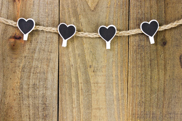 Black and white heart clips hanging from rope