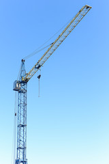building crane against the blue sky
