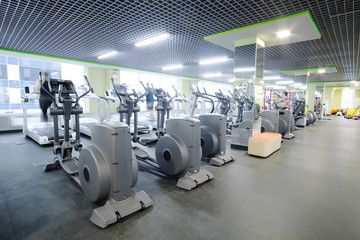 Interior of a modern fitness hall with fitness machines