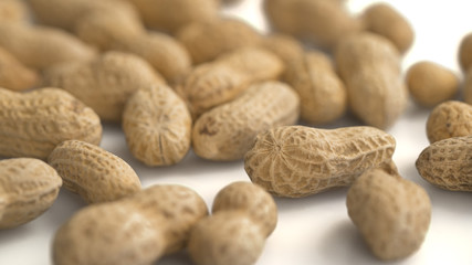 CLOSE UP: Peanuts on white background