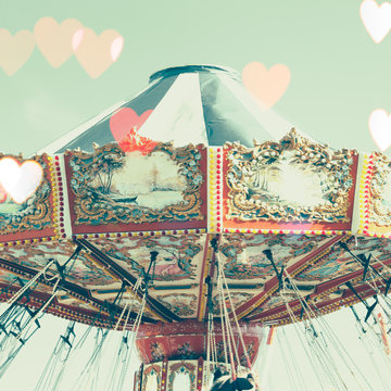 Vintage chain swing ride with heart overlay