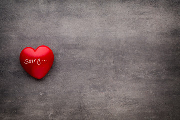 Obraz premium Valentine day Red heart on the dark boards.