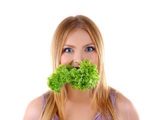 Young woman with fresh lettuce on white background