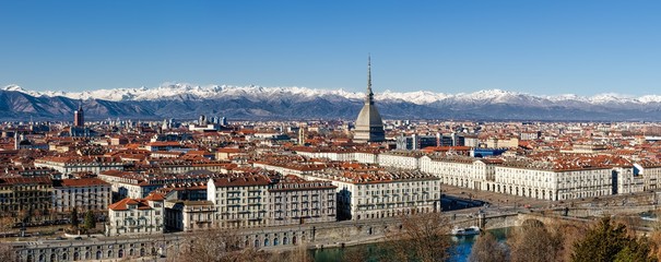 Winter panorama of Turin (Piedmont, Italy), with the Mole Antonelliana, Vittorio Veneto square and snowy mountains on the background - obrazy, fototapety, plakaty