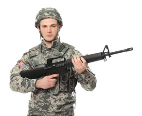 Soldier with assault riffle on white background