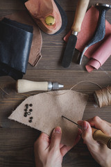 cobbler tools in workshop dark background top view