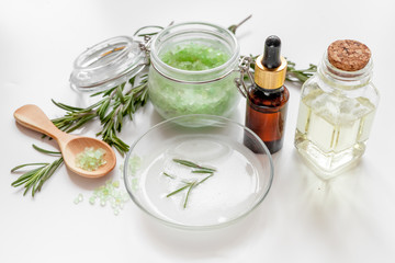 organic cosmetics with extracts of herbs rosemary on white background
