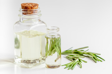 organic cosmetics with extracts of herbs rosemary on white background