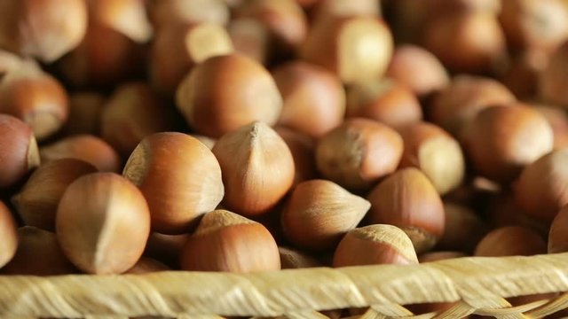 filbert nuts. Placer in a wicker basket, close-up