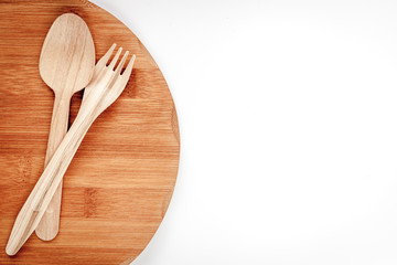 wooden kitchen utensils on white background top view