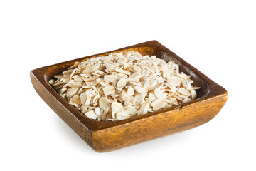 Oatmeal in wooden bowl