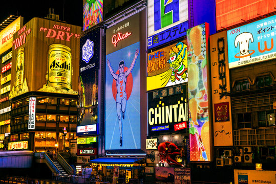OSAKA, JAPAN - NOVEMBER 24, 2014: The Glico Man billboard and other light displays