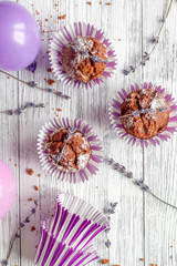 concept of Valentine's Day cupcakes wooden background top view