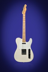 Beige six-string electric guitar standing vertically isolated on a blue background