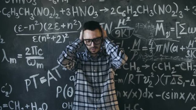 scientist man disappointed about problems experiment in chemical and mathematical equations room