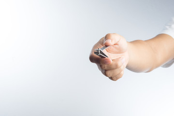 Hand with nail clipper