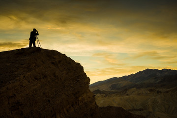 Photographer at Zabriskie Point before sunrise, Death Valley, CA