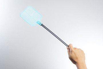 hand holding fly or insect swatter